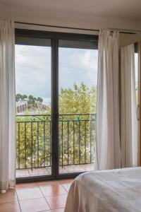 a bedroom with a large window with a view of the ocean at Regina's Banyuls - Top view in Banyuls-sur-Mer