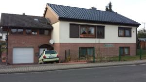 a house with a car parked in front of it at Suite Elisabeth in Wetzlar