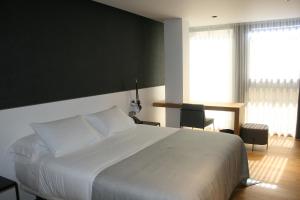 Postel nebo postele na pokoji v ubytování Hotel U Viveiro