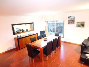 a dining room with a table and chairs at Beach House - Between Porto and Viana do Castelo in Esposende