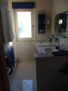 a bathroom with a sink and a window at CASA CALMA in La Pared