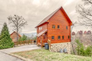 a large wooden house with a red roof at Sweet Surrender in Pigeon Forge