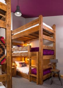 a bunk bed with two bunk beds in a room at The Bivvi Hostel in Breckenridge