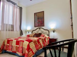 Postel nebo postele na pokoji v ubytování Hotel La Guaria Inn & Suites