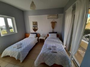 Katil atau katil-katil dalam bilik di Miramar Complex - Korfos