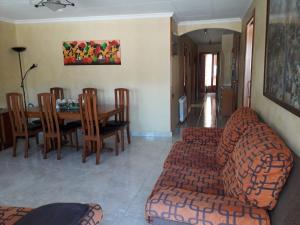 a living room with a couch and a table at Kal massis in Pinell de Bray