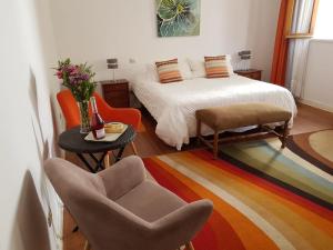 Cama ou camas em um quarto em Hostal Boutique Casa La Barca