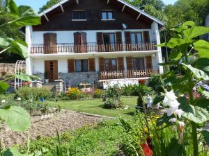a large house with a garden in front of it at Les Cèdres in Ax-les-Thermes