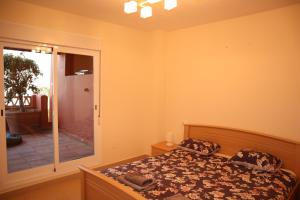 Ein Bett oder Betten in einem Zimmer der Unterkunft Penthouse Luxury Faro Casasol