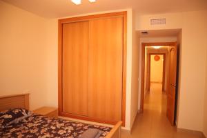 Ein Bett oder Betten in einem Zimmer der Unterkunft Penthouse Luxury Faro Casasol