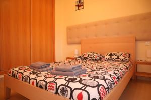Ein Bett oder Betten in einem Zimmer der Unterkunft Penthouse Luxury Faro Casasol