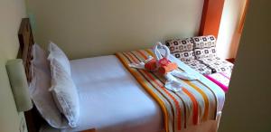 Voodi või voodid majutusasutuse Hostal Vista Waynapata 123 toas