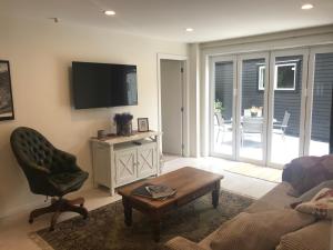 a living room with a couch and a chair at Villa @23 in Wanaka +15 photos