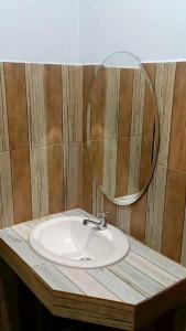 a bathroom with a sink and a mirror at Nong Or Blue House Resort in Sukhothai +8 photos