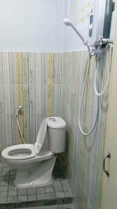 a bathroom with a toilet and a shower at Nong Or Blue House Resort in Sukhothai