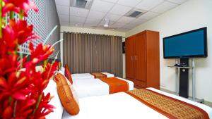Postel nebo postele na pokoji v ubytování Hotel Pooja Palace