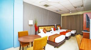 Postel nebo postele na pokoji v ubytování Hotel Pooja Palace