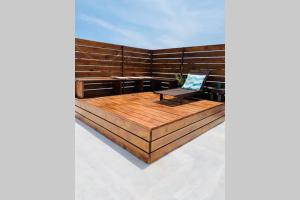 a sauna with a bench and a chair in it at Lower Point Surf Studio 2 in Jeffreys Bay