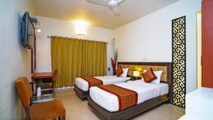 Postel nebo postele na pokoji v ubytování Hotel Pooja Palace