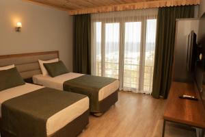 A bed or beds in a room at Royal Villa