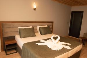 A bed or beds in a room at Royal Villa
