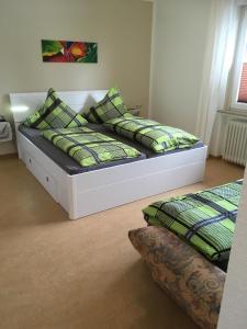 a bed with two pillows on it in a room at Töff - Töff in Willingen