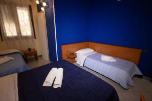 Postel nebo postele na pokoji v ubytování Hotel Merlino