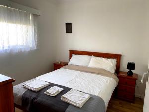 a bedroom with a bed and a lamp at Waldeck Heights in Geraldton
