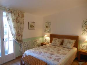 Posteľ alebo postele v izbe v ubytovaní Les Passiflores