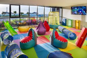 a childrens play room with colorful inflatable beds at Millennium Place Barsha Heights Hotel in Dubai