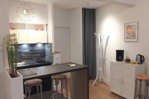 Кухня или кухненски бокс в Appartement grande chaussée Lille