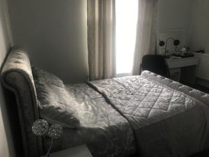 Cama o camas de una habitación en The Comat