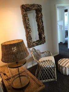 a room with two chairs and a mirror on the wall at Hotel Strand No.1 in Sankt Peter-Ording