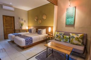 Postel nebo postele na pokoji v ubytování Pangkung Sari Bed and Breakfast