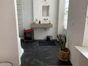 a bathroom with a sink and a mirror at Liberté in Marseille