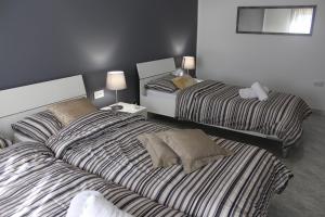 מיטה או מיטות בחדר ב-Cosy Home