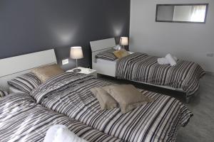 a bedroom with two beds at Cosy Home in Mellieħa