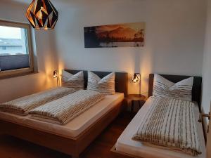 Postel nebo postele na pokoji v ubytování Apart Alexandra + 7 fotografií
