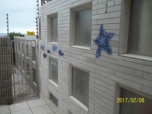 a building with a star on the side of it at Waterkant 4B in Jeffreys Bay