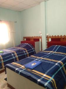 Wangtong Resort 2 tesisinde bir odada yatak veya yataklar