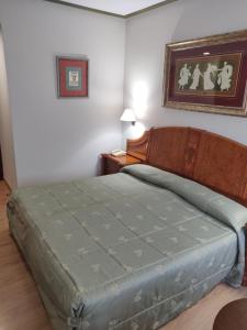 Łóżko lub łóżka w pokoju w obiekcie Hotel Chef Rivera