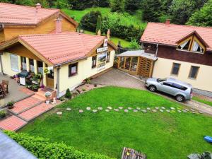 an aerial view of a house with a yard at Penzión Pod Guglom in Mlynky 