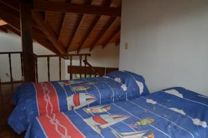 Ένα ή περισσότερα κρεβάτια σε δωμάτιο στο Casa de las 3 chimeneas