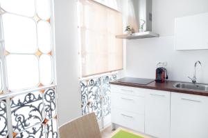 Kuchyňa alebo kuchynka v ubytovaní Hispalis Casa Palacio Apartment