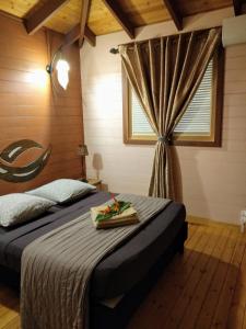 Postel nebo postele na pokoji v ubytování Villa & Bungalow Fleur de Coco