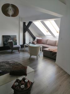 a living room with a couch and a table at Miaap Apartments in Sarajevo