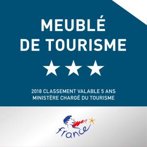 a sign that reads neville de toucourse with white stars at Studio 237 Port Camargue, Piscine, Climatisation, 2 personnes in Le Grau-du-Roi