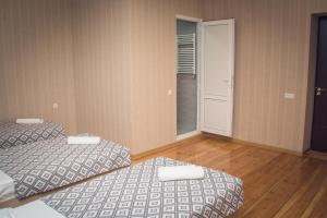 מיטה או מיטות בחדר ב-Dreamland Guest House