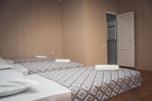 מיטה או מיטות בחדר ב-Dreamland Guest House
