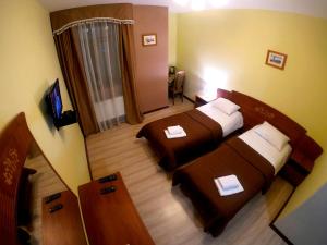 Postel nebo postele na pokoji v ubytování Hotel Lavilia